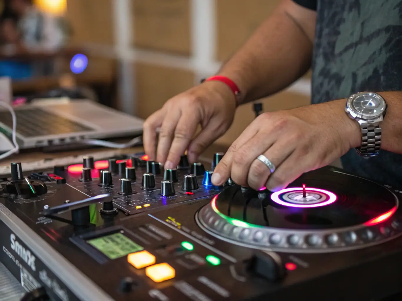 A close-up shot of a DJ skillfully scratching on a turntable during a workshop, showcasing the energy and precision involved in the technique.
